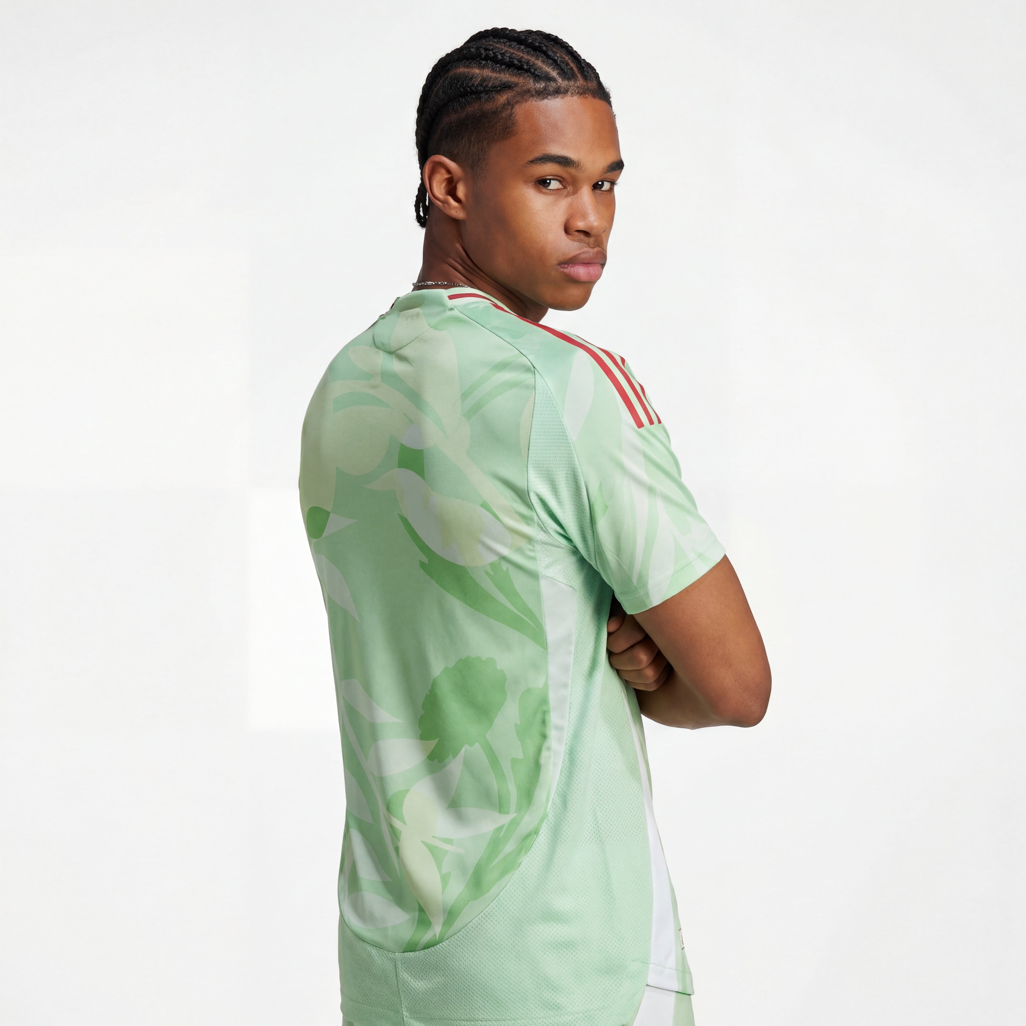 Light green Italy 25/26 player training jersey with floral pattern, red shoulder stripes