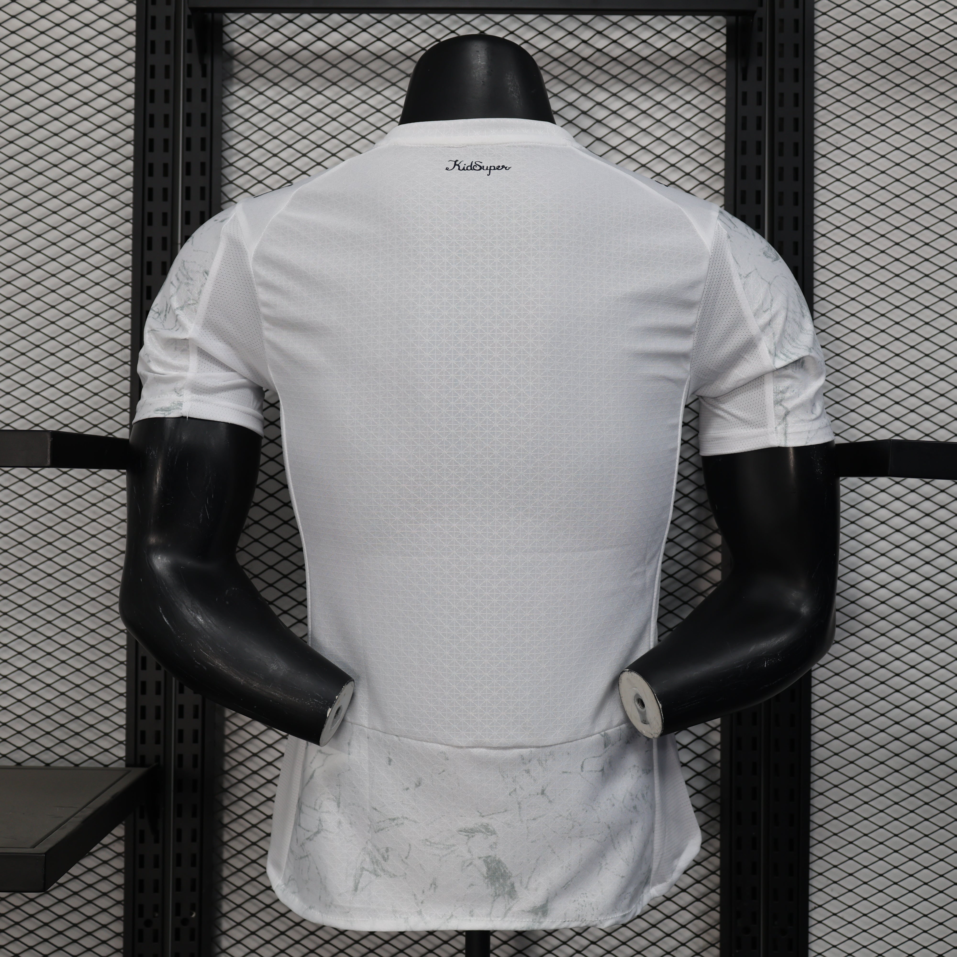 Back of Manchester City 25/26 away jersey with marble pattern and mesh panels