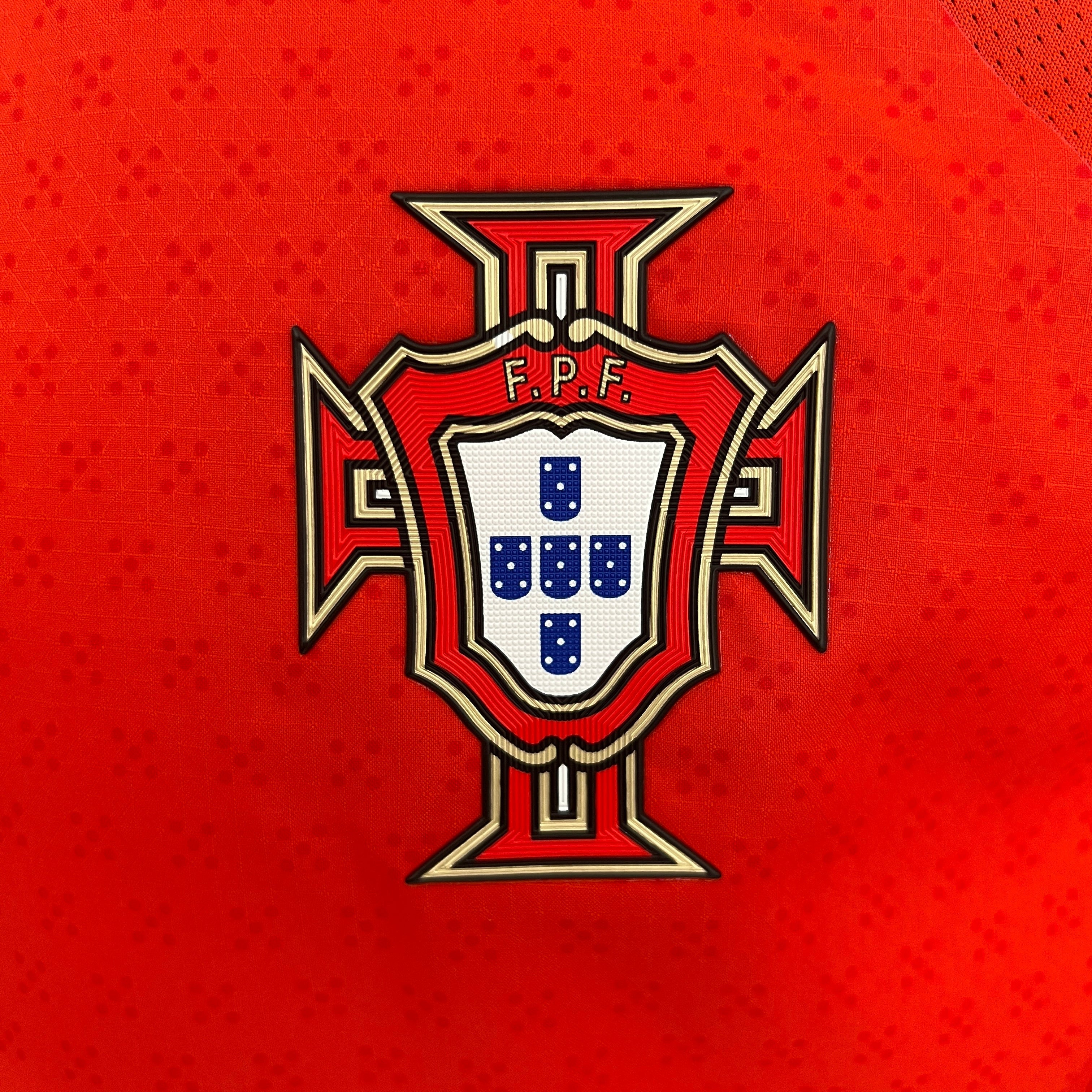 Portugal 25/26 home jersey with red crest gold trim blue shield 5 dots