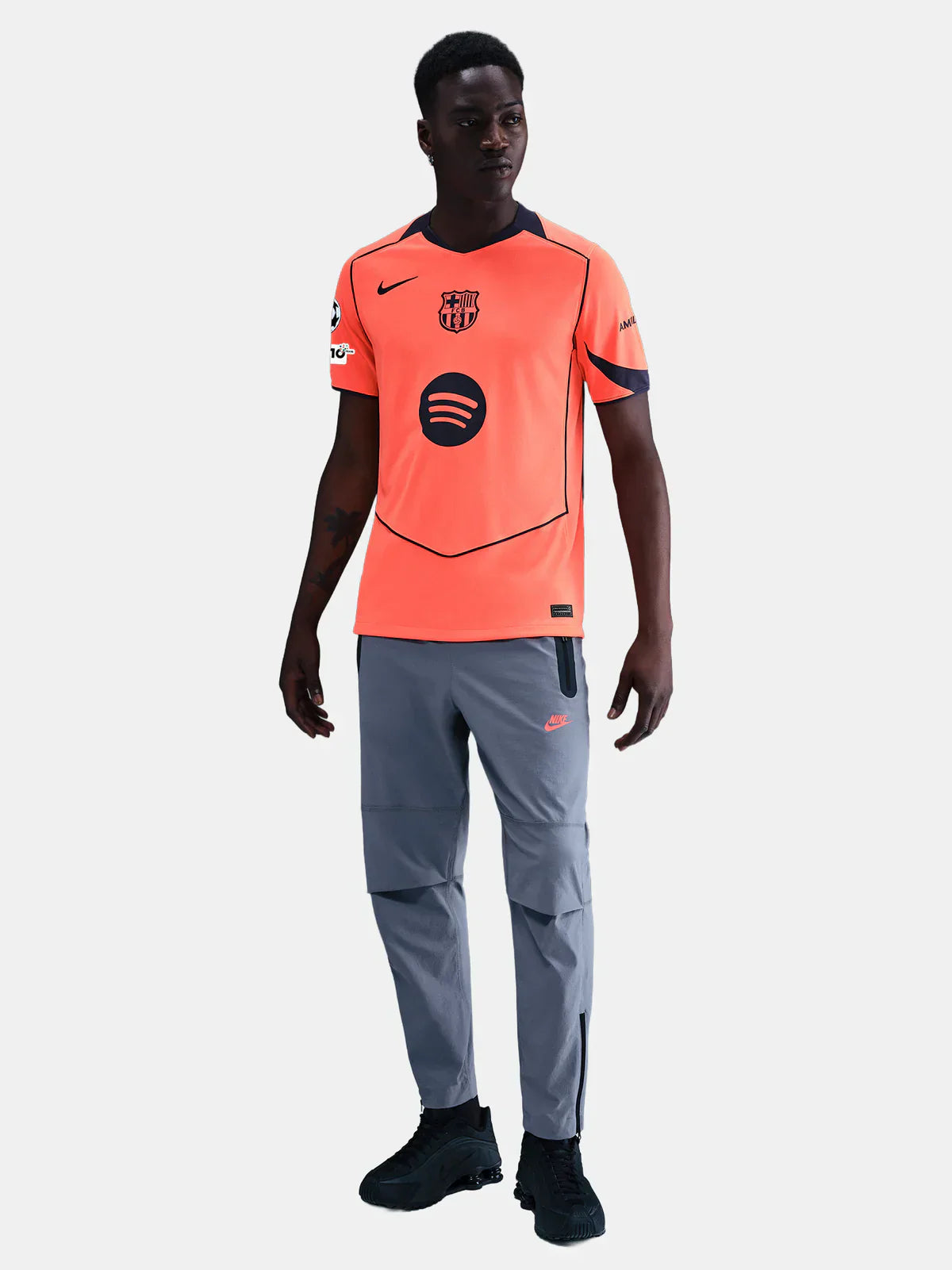 FC Barcelona 25/26 third vibrant orange Nike home jersey with black accents