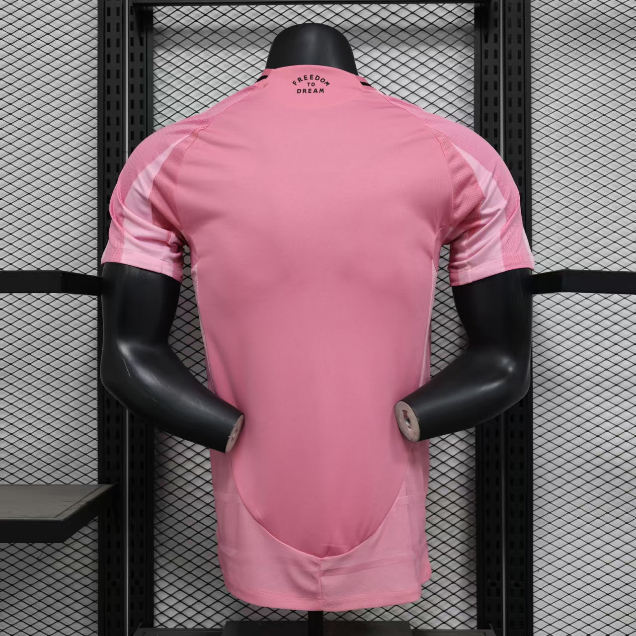 Pink Inter Miami 25/26 home jersey on black mannequin with white sleeve panels