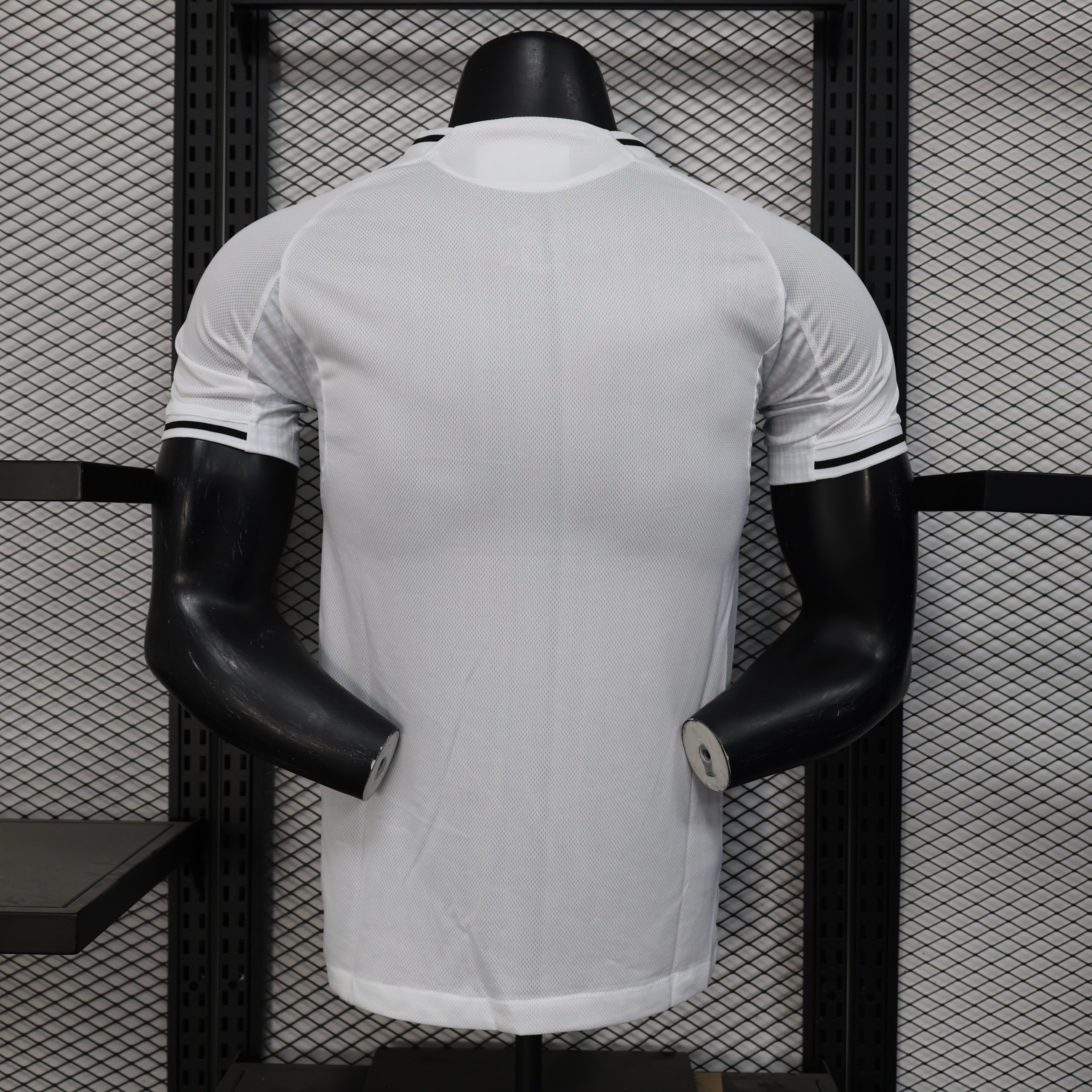 White New Castle 25/26 home player jersey with black trim on mannequin